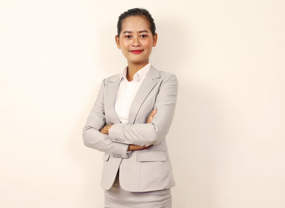 A Standing Woman in Business Attire 